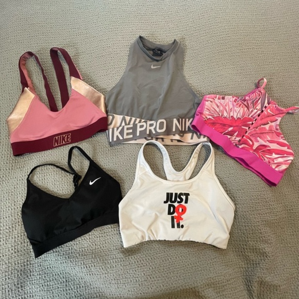 4 Nike Sports Bras- All size M except black bra. Black Bra is a S.